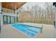 Sparkling blue pool and patio area of a modern home, designed for luxurious outdoor living and enjoyment at 4908 Birchleaf Dr, Raleigh, NC 27606