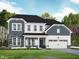 Charming two-story home featuring stone accents, blue shingles, black roof, white trim, and a well-manicured lawn at 5000 Trotter Dr, Raleigh, NC 27603