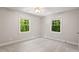 Bright bedroom with a neutral carpet and paint color, and great natural lighting at 5125 Penny Rd, Raleigh, NC 27606