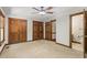 Spacious bedroom with hardwood door frames and a ceiling fan at 5125 Penny Rd, Raleigh, NC 27606