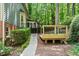 Exterior view of the side of the home with a deck at 5125 Penny Rd, Raleigh, NC 27606