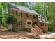 Beautiful two-story brick home with manicured front yard and inviting entrance staircase at 5125 Penny Rd, Raleigh, NC 27606