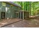 Exterior view of the house with a deck and screened in porch at 5125 Penny Rd, Raleigh, NC 27606
