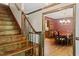 Foyer with hardwood steps and a view of the dining room at 5125 Penny Rd, Raleigh, NC 27606