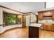 Kitchen with central island, stainless dishwasher and sink under a bay window at 5125 Penny Rd, Raleigh, NC 27606