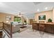 Cozy living room with wet bar, ceiling fan, and natural lighting at 5125 Penny Rd, Raleigh, NC 27606