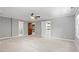 Spacious main bedroom featuring a ceiling fan, with doorways to an ensuite bathroom and walk-in closet at 5125 Penny Rd, Raleigh, NC 27606