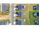 An aerial view displays homes, some featuring solar panels, in a well-maintained neighborhood at 5420 Mill Dam Rd, Wake Forest, NC 27587