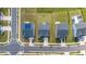 An aerial view showcases homes in a neighborhood, one with solar panels on the roof and green lawns at 5420 Mill Dam Rd, Wake Forest, NC 27587