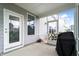 Relaxing screened-in porch with access to the backyard, perfect for outdoor dining and entertaining at 5420 Mill Dam Rd, Wake Forest, NC 27587