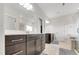 Bright bathroom boasts double vanity with sleek countertops, and a glass-enclosed shower at 5420 Mill Dam Rd, Wake Forest, NC 27587