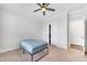 Well-lit bedroom featuring a ceiling fan, a closet and neutral carpet, creating a cozy retreat at 5420 Mill Dam Rd, Wake Forest, NC 27587