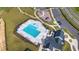 An aerial view of a community pool, playground and clubhouse set in landscaped surroundings at 5420 Mill Dam Rd, Wake Forest, NC 27587