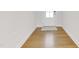 The entryway with light-colored hardwood flooring and a neutral area rug at 5420 Mill Dam Rd, Wake Forest, NC 27587