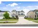 Charming two-story home showcasing a two-car garage, lush landscaping, and inviting curb appeal at 5420 Mill Dam Rd, Wake Forest, NC 27587