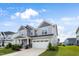 Charming two-story home with a well-manicured lawn, a two-car garage, and inviting curb appeal at 5420 Mill Dam Rd, Wake Forest, NC 27587