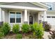 Charming home featuring a covered front porch with stone accents and well-maintained landscaping at 5420 Mill Dam Rd, Wake Forest, NC 27587