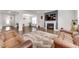 Bright living room featuring a cozy fireplace, hardwood floors, and modern decor with open spaces at 5420 Mill Dam Rd, Wake Forest, NC 27587