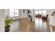 Open-concept design featuring hardwood floors, neutral paint, and an open-concept living and dining area at 5420 Mill Dam Rd, Wake Forest, NC 27587