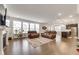 Spacious open-concept living room with hardwood floors, large windows, and modern furnishings at 5420 Mill Dam Rd, Wake Forest, NC 27587