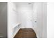 Well-lit mudroom featuring a built-in bench with storage and coat hooks, leading to the main house at 5420 Mill Dam Rd, Wake Forest, NC 27587