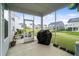 Screened porch offering outdoor living space and views of the backyard at 5420 Mill Dam Rd, Wake Forest, NC 27587