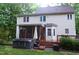Backyard featuring a hot tub, patio, and serene view at 5917 Clearsprings Dr, Wake Forest, NC 27587