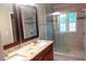 Luxury bathroom features a glass shower, dual sinks with granite counters, and natural light at 5917 Clearsprings Dr, Wake Forest, NC 27587