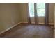 Neutral bedroom with a window providing natural light and soft carpet flooring at 5917 Clearsprings Dr, Wake Forest, NC 27587