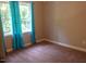 Cozy bedroom with large window and soft carpet flooring at 5917 Clearsprings Dr, Wake Forest, NC 27587