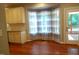 Cozy breakfast nook in the kitchen with cream cabinetry, granite countertops, and a view of the outdoor deck at 5917 Clearsprings Dr, Wake Forest, NC 27587