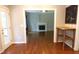 Inviting living area with a fireplace, hardwood floors, and seamless transition to the outdoor space through a glass door at 5917 Clearsprings Dr, Wake Forest, NC 27587