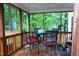 Inviting screened porch featuring a ceiling fan and comfortable seating for outdoor relaxation and entertaining at 5917 Clearsprings Dr, Wake Forest, NC 27587