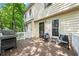 Back porch featuring outdoor seating, a grill, and an entrance to the home at 6 Weathergreen Ct, Durham, NC 27713