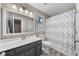 Well-maintained bathroom featuring a vanity with countertop, toilet, and shower with decorative curtain at 6 Weathergreen Ct, Durham, NC 27713