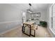 Contemporary dining room with wooden table, bench seating, modern lighting, and stylish decor at 6 Weathergreen Ct, Durham, NC 27713