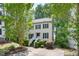 Charming two-story home with a well-manicured front yard, complimented with trees at 6 Weathergreen Ct, Durham, NC 27713
