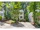 Two-story home with manicured landscaping, complimented with mature trees at 6 Weathergreen Ct, Durham, NC 27713