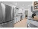 Modern kitchen featuring stainless steel appliances, white cabinets, and granite countertops at 6 Weathergreen Ct, Durham, NC 27713