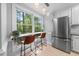 Eat-in kitchen featuring stainless steel appliances, granite counters, and natural lighting at 6 Weathergreen Ct, Durham, NC 27713