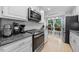 Kitchen with stainless steel appliances, ample counter space, and a cozy breakfast nook at 6 Weathergreen Ct, Durham, NC 27713