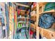Storage room features wood shelving with various tools and containers at 6 Weathergreen Ct, Durham, NC 27713
