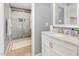 Modern bathroom with a glass door shower and a bright vanity area at 6004 Volant Dr, Raleigh, NC 27609