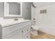 Bathroom featuring a modern vanity, tub/shower combo and neutral paint at 6004 Volant Dr, Raleigh, NC 27609