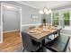 Well-lit dining room with decorative place settings, grey walls, and a sign at 6004 Volant Dr, Raleigh, NC 27609