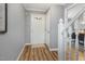 Bright foyer featuring hardwood floors and a staircase leading to the upper level at 6004 Volant Dr, Raleigh, NC 27609