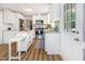 Bright white kitchen with stainless steel appliances and a butcher block island at 6004 Volant Dr, Raleigh, NC 27609