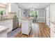 Bright kitchen with island and breakfast nook at 6004 Volant Dr, Raleigh, NC 27609