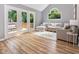 Open living room with glass doors leading to deck and vaulted ceilings at 6004 Volant Dr, Raleigh, NC 27609