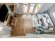 Aerial view of the living room showcasing hardwood floors, a fireplace, and a comfortable seating area at 6004 Volant Dr, Raleigh, NC 27609